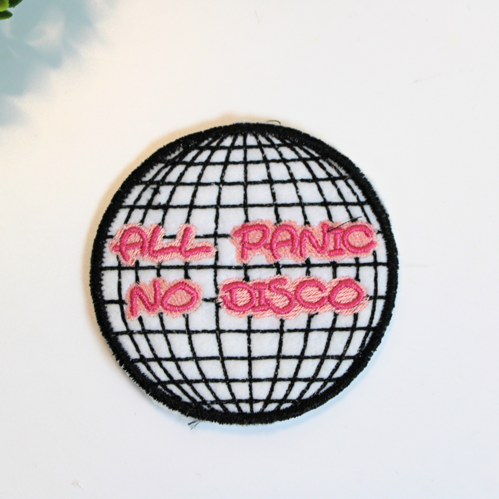 Embroidered patch with 'All Panic No Disco' text on a disco ball design.