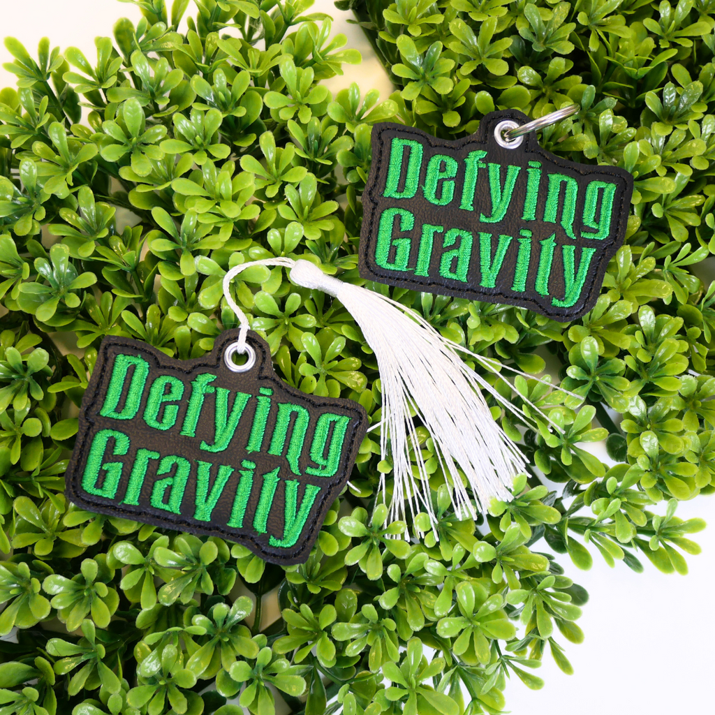 Defying Gravity Bookmark and Keychain