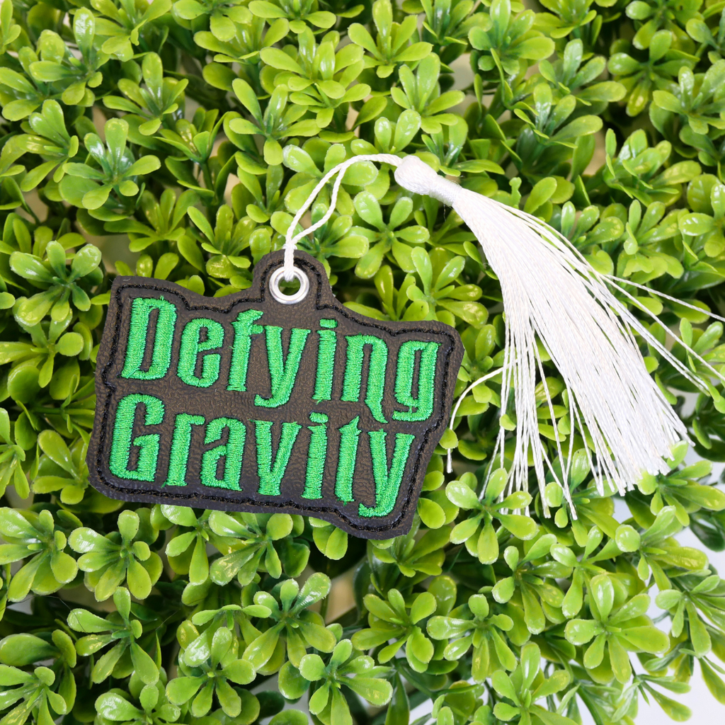 Defying Gravity Bookmark and Keychain