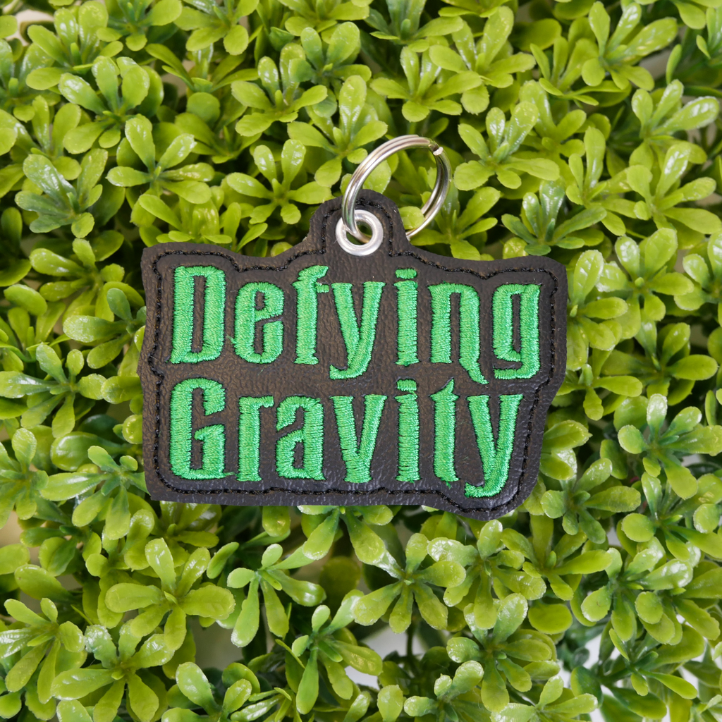 Defying Gravity Bookmark and Keychain