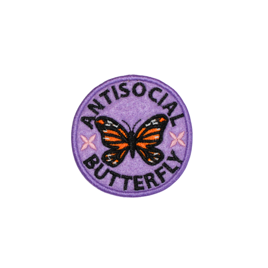 Round patch with a butterfly design and text 'ANTISOCIAL BUTTERFLY' on a purple background