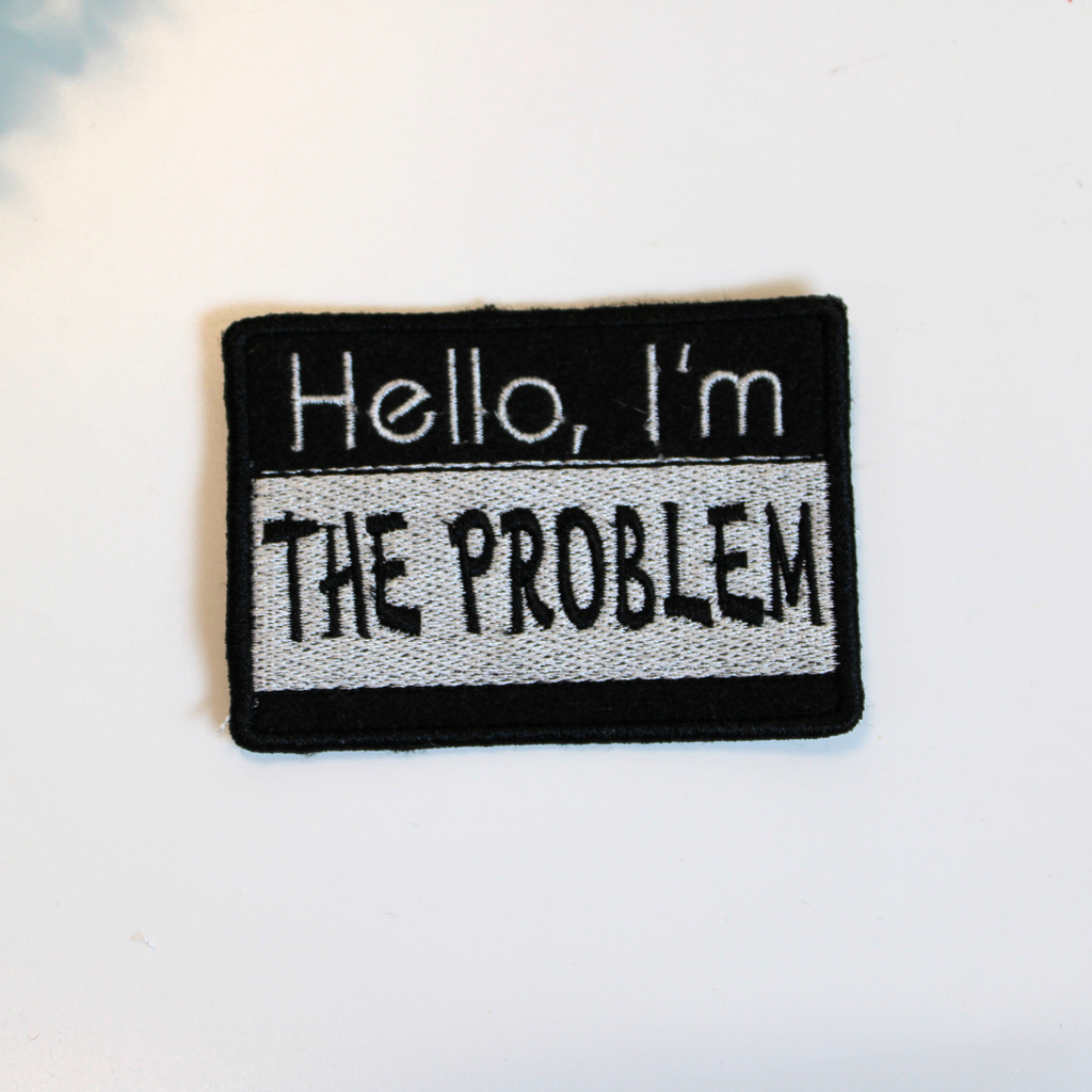 Patch with text 'Hello, I'm THE PROBLEM' on a light background
