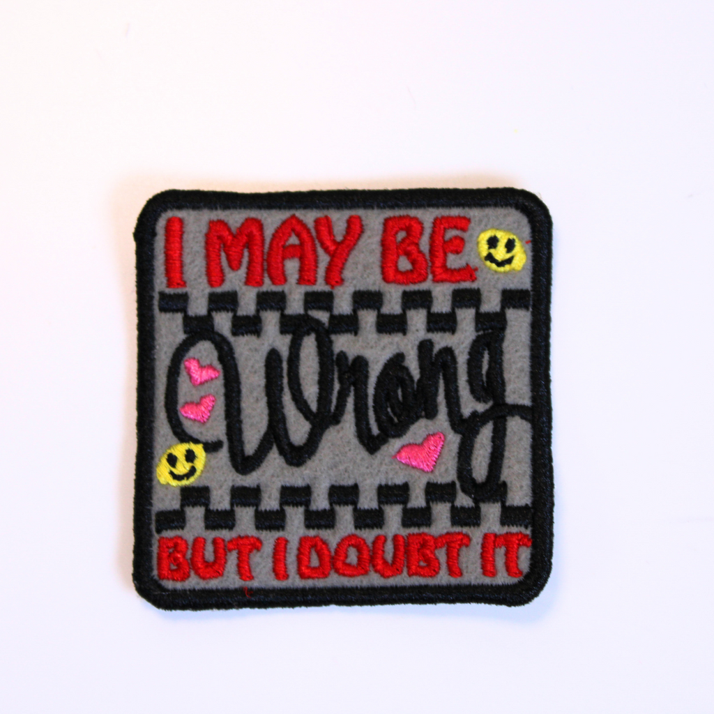 Patch with text 'I May Be Wrong But I Doubt It' on a gray background